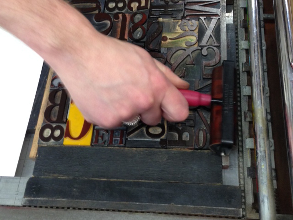 Inking a letterpress forme.